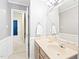 Bathroom with wood-style vanity, providing a practical and traditional design at 2107 Somers Ave, Burlington, NC 27215