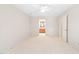 Spacious bedroom with a view into an en-suite bathroom, featuring neutral carpet and white walls at 2107 Somers Ave, Burlington, NC 27215