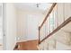 Inviting entryway featuring hardwood floors, a staircase, and a white front door at 2107 Somers Ave, Burlington, NC 27215