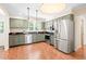 Beautiful kitchen with stainless steel appliances and hardwood floors, great for entertaining at 2107 Somers Ave, Burlington, NC 27215
