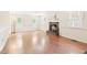 Open living room with hardwood floors, fireplace, and plenty of natural light at 2107 Somers Ave, Burlington, NC 27215