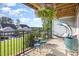 Relaxing balcony space with comfortable seating and a hanging planter at 217 Jones Hill Rd, Holly Springs, NC 27540
