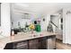 Open-concept kitchen with granite countertops, stainless appliances, and access to the living area at 217 Jones Hill Rd, Holly Springs, NC 27540