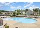 Large community pool surrounded by lounge chairs and lush landscaping, perfect for relaxation and recreation at 217 Jones Hill Rd, Holly Springs, NC 27540