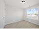 Bright and spacious bedroom with plush carpet, and a large window at 225 Alcock Ln, Youngsville, NC 27596