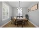 Elegant dining room with a rustic wooden table and stylish decor at 225 Alcock Ln, Youngsville, NC 27596