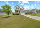 Beautiful two-story home with a well-maintained lawn and a concrete driveway at 225 Alcock Ln, Youngsville, NC 27596