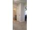 Hallway with carpeted floors leading to the bathroom and bedroom entrance at 225 Alcock Ln, Youngsville, NC 27596