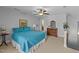 This spacious bedroom has a queen bed, ceiling fan, carpet and a dresser at 232 Shady Hollow Ln, Garner, NC 27529