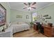 This cozy bedroom features a daybed, a ceiling fan, and a built-in desk at 232 Shady Hollow Ln, Garner, NC 27529