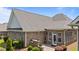 This house features a brick exterior, well maintained landscaping, and a screened in patio at 232 Shady Hollow Ln, Garner, NC 27529
