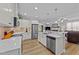 Spacious eat-in kitchen has granite countertops, stainless appliances, white cabinetry, and pendant lighting at 232 Shady Hollow Ln, Garner, NC 27529