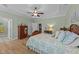 Relax in this main bedroom boasting trey ceilings, wood flooring, and large furniture at 232 Shady Hollow Ln, Garner, NC 27529