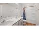 Bright bathroom with double sink vanity and a shower/tub combination with a shower curtain at 2406 Lily Dr, Haw River, NC 27258
