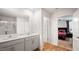 Bright bathroom features a double sink vanity with white countertops and wood look flooring at 2406 Lily Dr, Haw River, NC 27258