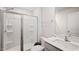 Clean bathroom features a glass-enclosed shower and a modern vanity with quartz countertops at 2406 Lily Dr, Haw River, NC 27258