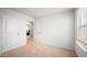 Bedroom featuring carpet, white walls, and white trim with view to home office at 2406 Lily Dr, Haw River, NC 27258