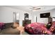 Bright bedroom with natural light, a cozy armchair, dresser, and ensuite bathroom access at 2406 Lily Dr, Haw River, NC 27258