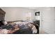 Cozy bedroom with neutral walls, a large bed, and a dresser with a TV mounted above at 2406 Lily Dr, Haw River, NC 27258
