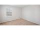 Neutral bedroom featuring carpet, white walls, and a single window with blinds at 2406 Lily Dr, Haw River, NC 27258