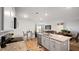 Open kitchen showcasing an island with granite counters that connects to living and dining areas at 2406 Lily Dr, Haw River, NC 27258