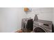 Laundry room with front loading washer and dryer and wire shelving for extra storage at 2406 Lily Dr, Haw River, NC 27258