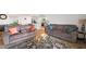 Comfortable living room with modern furniture, a glass table, and an open concept layout at 2406 Lily Dr, Haw River, NC 27258