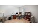 Home office area with a desk, office chair, and a bookcase next to a window at 2406 Lily Dr, Haw River, NC 27258