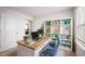 Home office features a bookshelf, desk, and chair in a bright room at 2406 Lily Dr, Haw River, NC 27258