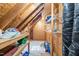 Attic storage space with open wooden beams, shelving, and ample room for organization at 2408 Fordcrest Dr, Apex, NC 27502