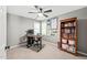 Bedroom with carpet, a bookcase, two windows, and a desk with a computer setup at 2408 Fordcrest Dr, Apex, NC 27502