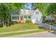 Charming two-story home featuring a well-maintained lawn, lush landscaping, and a welcoming front porch at 2408 Fordcrest Dr, Apex, NC 27502