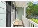 Side of the front porch featuring windows with black shutters and a bench for seating at 2408 Fordcrest Dr, Apex, NC 27502