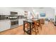 Updated kitchen with stainless steel appliances, a large island, and seamless flow to the living area at 2408 Fordcrest Dr, Apex, NC 27502