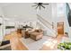 Open-concept living room with high ceilings, a staircase, and a view of the kitchen at 2408 Fordcrest Dr, Apex, NC 27502