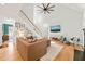 Spacious living room with a two-story ceiling, a staircase, and a large sectional sofa at 2408 Fordcrest Dr, Apex, NC 27502