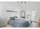 Bright main bedroom with high ceilings, neutral colors, and an exit to a private balcony at 2408 Fordcrest Dr, Apex, NC 27502