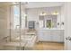 Luxury bathroom with dual vanity, soaking tub, and a glass-enclosed shower showcasing high-end fixtures and finishes at 249 Salt Cedar Ln, Chapel Hill, NC 27516
