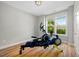 Bedroom with workout equipment and lots of natural light at 249 Salt Cedar Ln, Chapel Hill, NC 27516