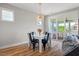 Dining area showcases stylish light fixture and sliding doors leading to outdoor space at 249 Salt Cedar Ln, Chapel Hill, NC 27516