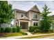 Well-maintained two-story home with a cozy front porch and lush greenery at 249 Salt Cedar Ln, Chapel Hill, NC 27516