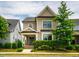 Charming two-story home with a welcoming front porch and manicured landscaping at 249 Salt Cedar Ln, Chapel Hill, NC 27516