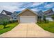 Detached two-car garage with driveway access and well-kept lawn at 249 Salt Cedar Ln, Chapel Hill, NC 27516