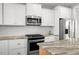 Modern kitchen featuring stainless steel appliances, white subway tile backsplash and granite countertops at 249 Salt Cedar Ln, Chapel Hill, NC 27516