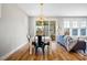 Open-concept living room and dining area with lots of natural light at 249 Salt Cedar Ln, Chapel Hill, NC 27516