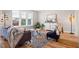 Cozy living room with lots of natural light and wood-look flooring at 249 Salt Cedar Ln, Chapel Hill, NC 27516