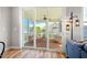 View of the covered porch with seating from the living room at 249 Salt Cedar Ln, Chapel Hill, NC 27516