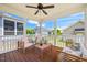 Screened porch with wood floors, ceiling fan, and seating offering an outdoor living area at 249 Salt Cedar Ln, Chapel Hill, NC 27516
