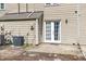 Backyard featuring a small patio area and French doors leading into the home at 2519 Hitchcock Dr, Durham, NC 27705