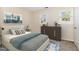 Bright bedroom featuring a queen-sized bed, neutral walls, and two windows at 2519 Hitchcock Dr, Durham, NC 27705